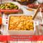 butternut mac and cheese casserole, topped with breadcrumbs, in a white baking dish