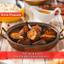 roasted sweet potatoes, seasoned with herbs, in a copper pan